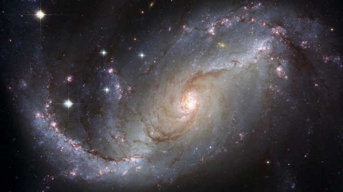 Barred spiral galaxy with bright core and arms
