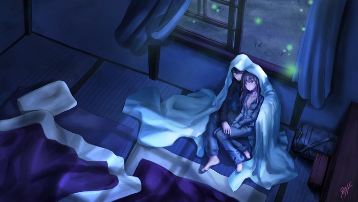 Couple under blanket at night