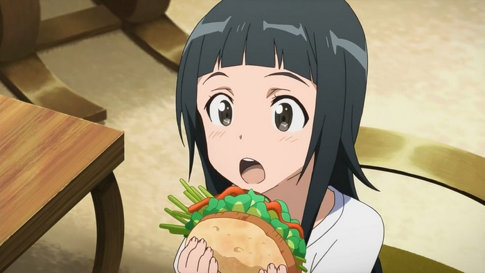 Yui from Sword Art Online eating a sandwich