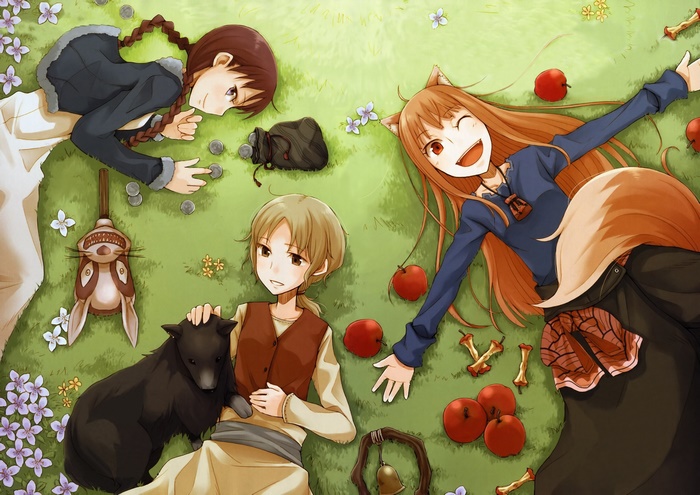 Holo and friends lying on grass with apples