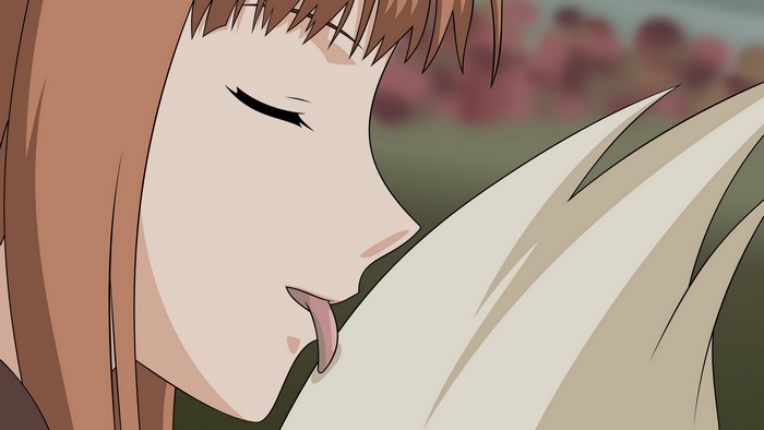 Holo from Spice & Wolf licking fur