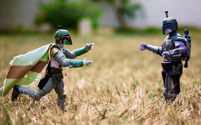 Boba Fett action figures in a field