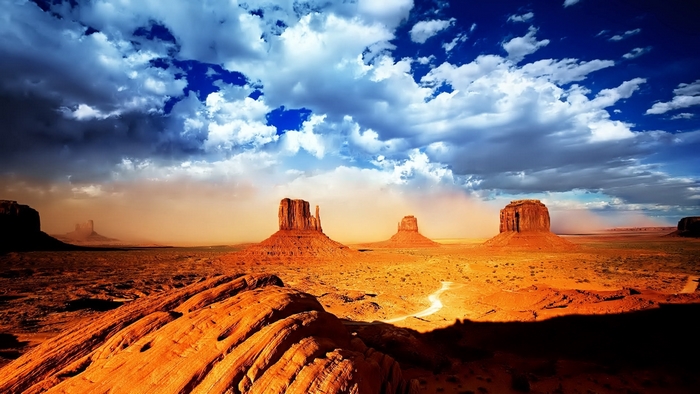 Monument Valley desert landscape with dramatic clouds