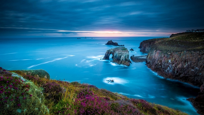 Coastal cliffs and ocean at dusk