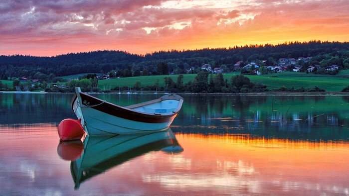 Boat and Buoy on Lake at Sunset in France