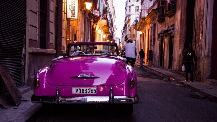 Pink convertible car on a street in Havana