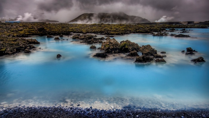 Blue Lagoon geothermal spa with volcanic rocks and steam