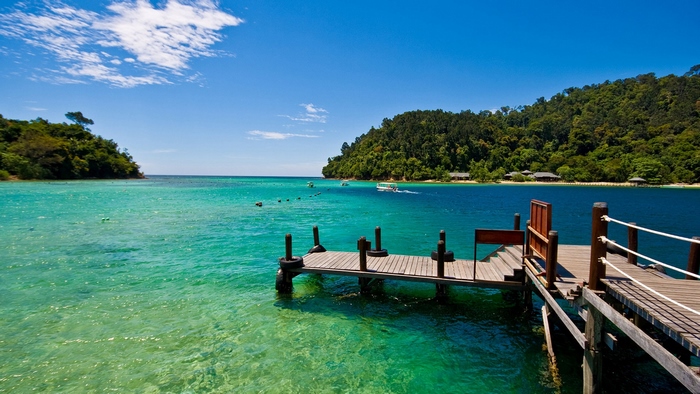 Wooden pier on a tropical island with turquoise water