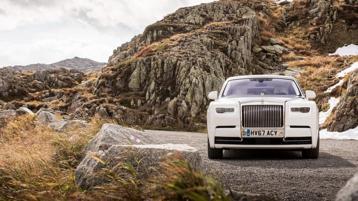 White Rolls-Royce Phantom on a mountain road