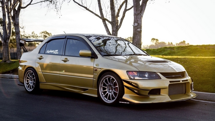 Gold Mitsubishi Lancer Evolution VIII tuner car
