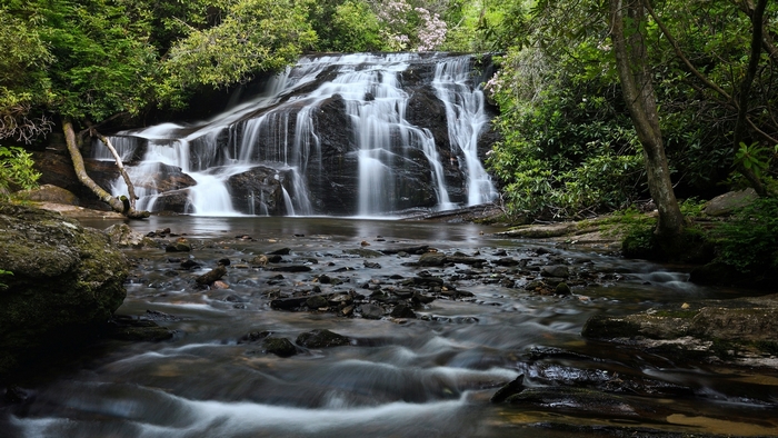 Waterfall flowing over rocks in a forest