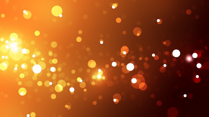 Abstract bokeh lights on orange and brown background
