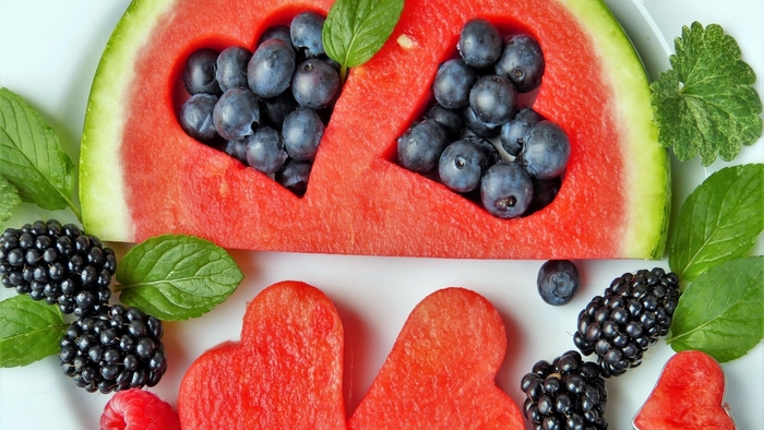 Watermelon hearts with blueberries and blackberries