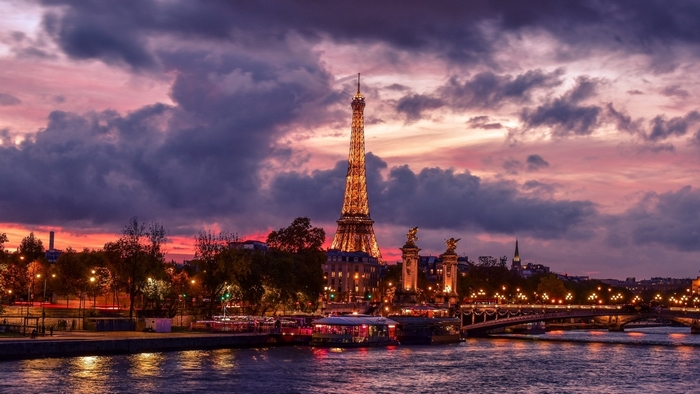 Eiffel Tower at sunset over the Seine River in Paris