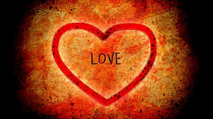 Red heart with the word LOVE on a grunge background