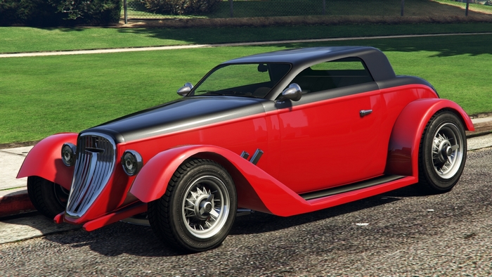 Red and black vintage convertible car on a street