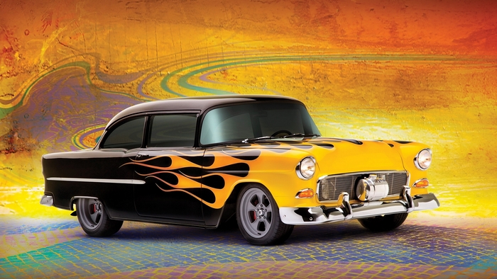 Black and yellow classic car with flames