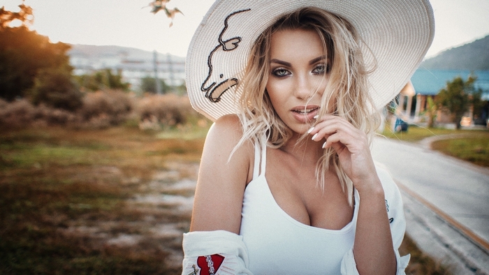 Blonde Woman in White Hat Outdoors