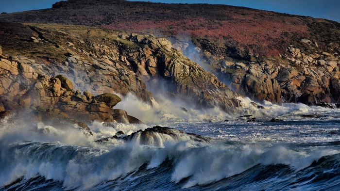 Waves crashing against a rocky coast