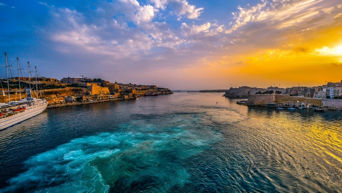 Cruise ship in Grand Harbour, Valletta, Malta at sunrise