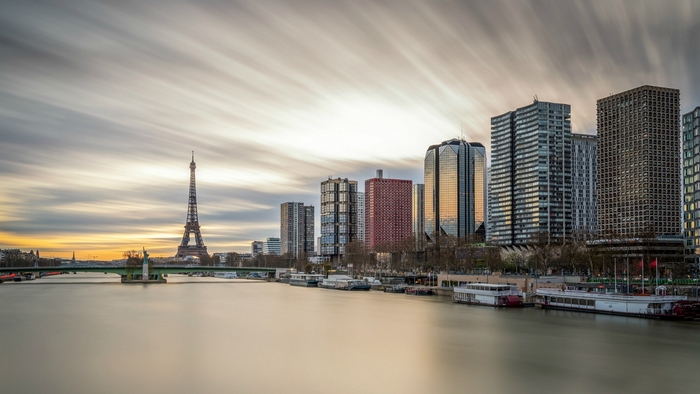 Paris skyline with Eiffel Tower and skyscrapers over the Seine River