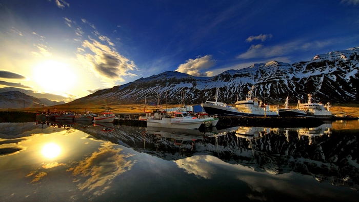 Sunset Harbor with Reflective Mountain View