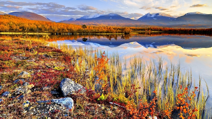 Autumn landscape with lake and mountains