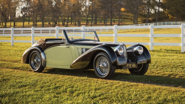 Bugatti 57S Cabriolet parked on a grassy field
