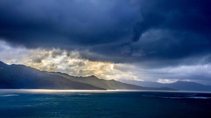 Stormy Sky Over Mountains and Sea