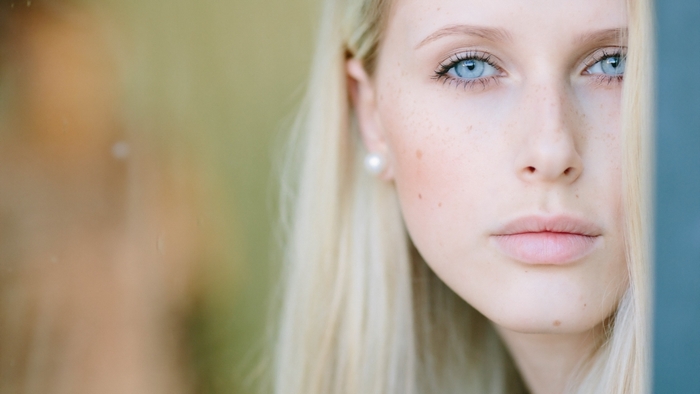 Close-up of a blonde woman with blue eyes