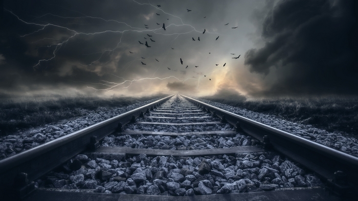 Stormy Railroad Perspective with Dark Clouds