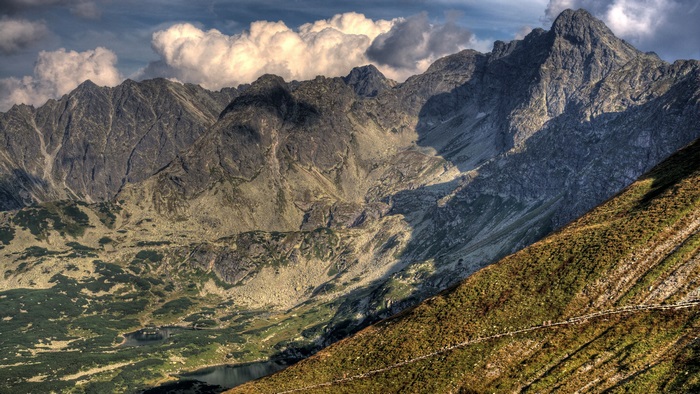 Mountain range with valley and clouds