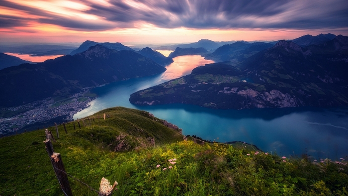 Mountains and lake at twilight with clouds
