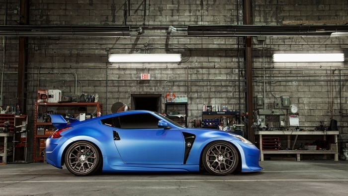 Blue Nissan 370Z in a garage