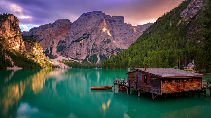 Serene Braies Lake with Cabin and Dolomite Mountains
