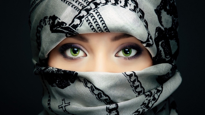 Mysterious Woman with Green Eyes Wrapped in Scarf