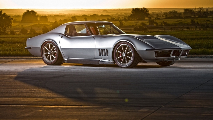 Silver classic Chevrolet Corvette Stingray at sunset