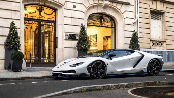 Sleek White Lamborghini Sports Car on City Street