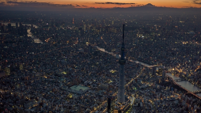 Tokyo cityscape at dusk with Mount Fuji in the distance
