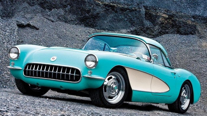 Turquoise Chevrolet Corvette C1 parked on gravel