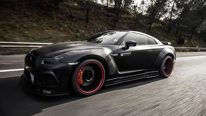 Matte black Nissan GT-R with red trim wheels