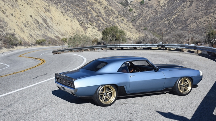 Blue 1969 Chevrolet Camaro on a winding mountain road