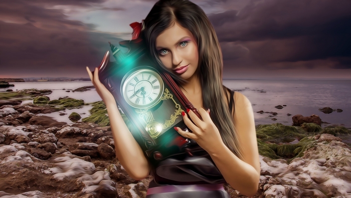 Woman holding an antique clock by the sea