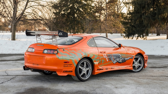 Orange Toyota Supra Coupe with Racing Graphics