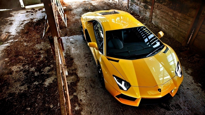 Yellow Lamborghini Aventador in a Barn