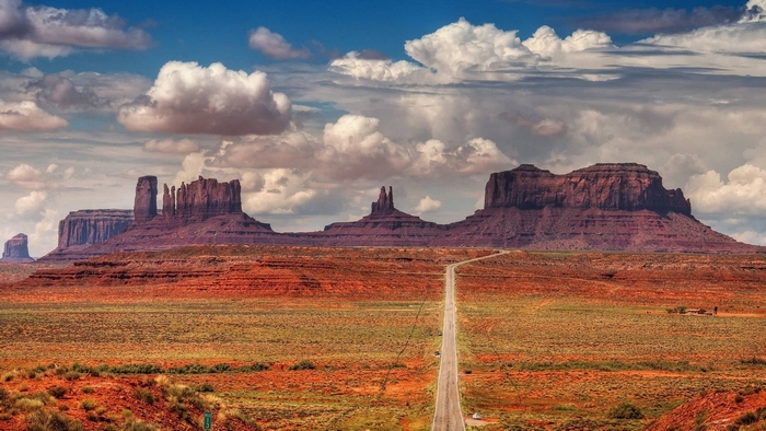 Monument Valley desert landscape with buttes and road