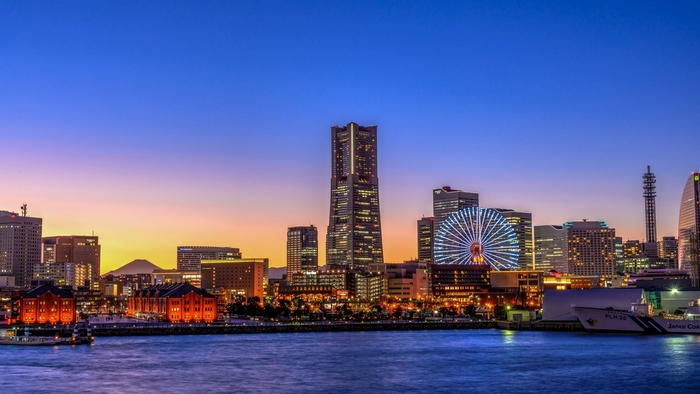 Yokohama cityscape with Landmark Tower and Ferris wheel at dusk