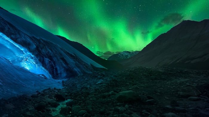 Northern Lights Over Rocky Mountain Landscape