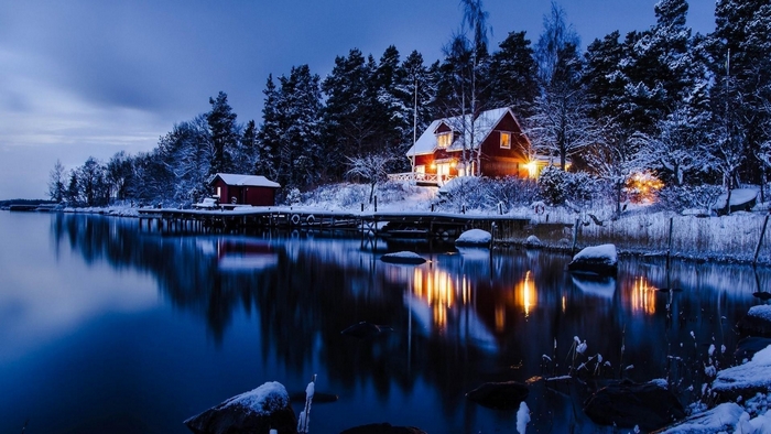 Winter cabin by a lake in Sweden