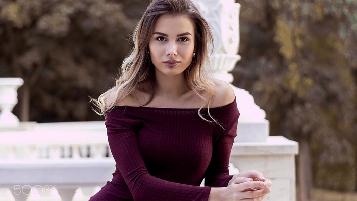 Elegant Woman in Off-Shoulder Burgundy Dress